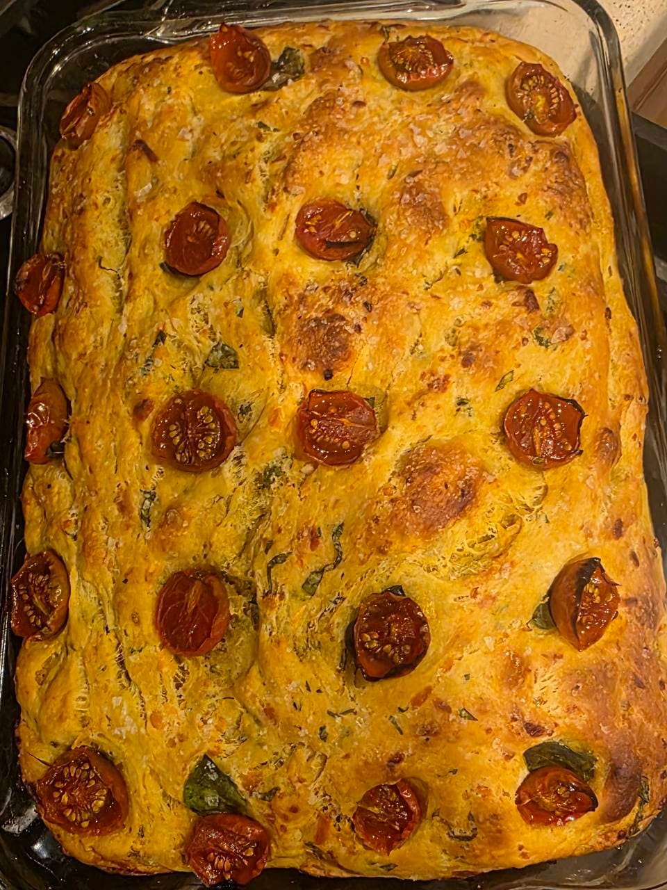 Focaccia made with tumeric. Home grown tomatoes garlic and basil from our garden (4/4)